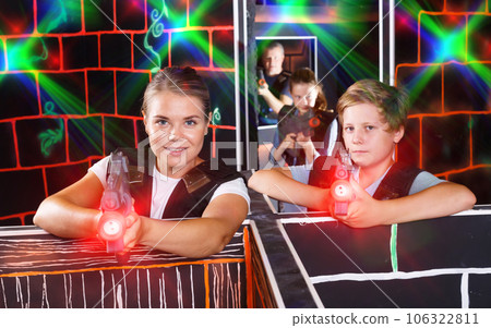 Positive boy and his mother aiming laser guns Positive boy and his mother aiming laser guns 106322811