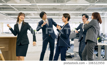 Group of office workers dancing in the office 106322950