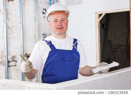 Satisfied construction worker 106323048