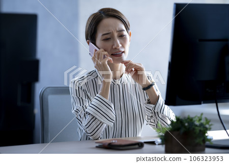 Business woman working overtime 106323953