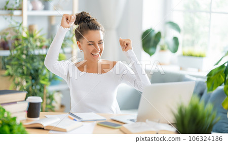 woman working on laptop at home. woman working on laptop at home. 106324186