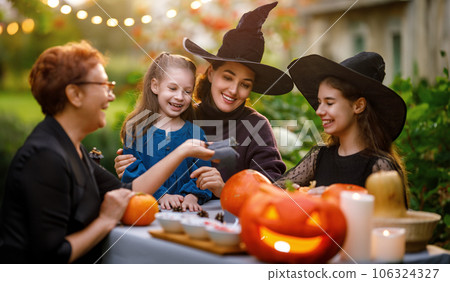 family preparing for Halloween 106324327