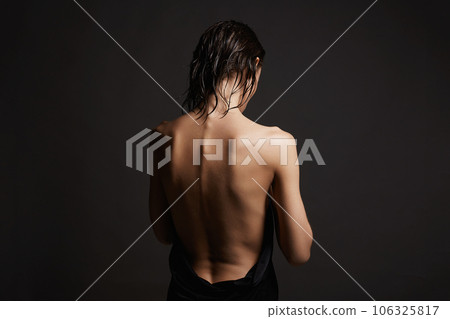 Naked Female back. young wet woman in the towel 106325817