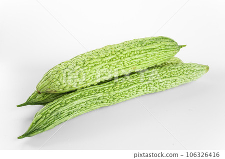 Bitter gourd on a white background board. Bitter gourd on a white background board. 106326416