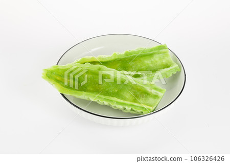 Bitter gourd on a white background board. Bitter gourd on a white background board. 106326426