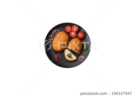 Delicious baked cutlet breaded with spices, salt and herbs 106327947
