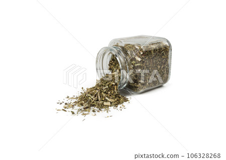 Dry Tansy Herb in latin Tanacetum vulgare falling from glass jar isolated on white background. Dry Tansy Herb in latin Tanacetum vulgare falling from glass jar isolated on white background. 106328268