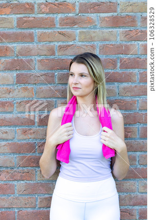 Energetic Fitness Woman: Smiling and Refreshed After Training 106328529