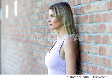 Morning Jogging Break: Sweaty Fitness Girl Catching Her Breath Outdoors 106328530