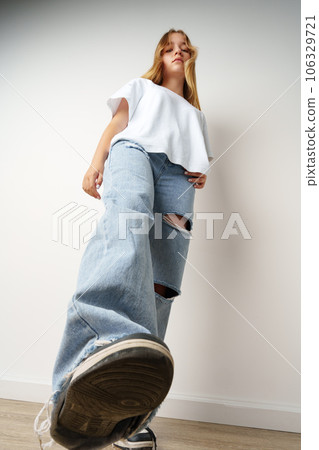 Portrait of young beautiful cute teen girl posing at camera Portrait of young beautiful cute teen girl posing at camera 106329721