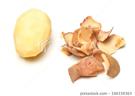 peeled raw potatoes close-up, the object is isolated on a white background 106330363