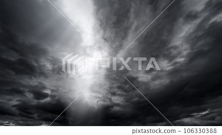 dark dramatic sky with black stormy clouds before rain or snow as abstract background, extreme weather, the sun shines through the clouds, high contrast photo dark dramatic sky with black stormy clouds before rain or snow as abstract background, extreme weather, the sun shines through the clouds, high contrast photo 106330388