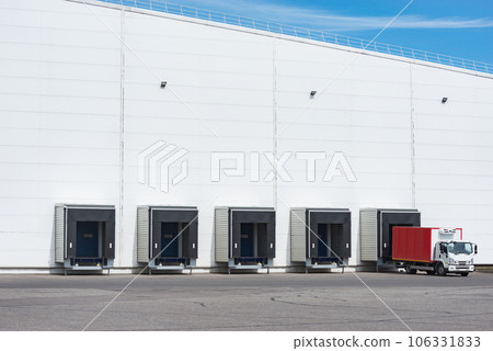 Freight truck stands by the door of the storage. Freight truck stands by the door of the storage. 106331833