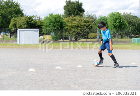A boy playing soccer 106332321