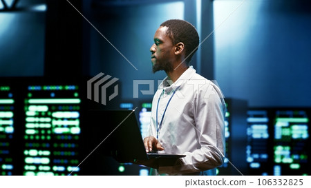 IT programmer setting up high tech facility advanced firewalls, intrusion detection systems and security updates. Cybersecurity supervisor preventing hacking, malware, and denial of service attacks IT programmer setting up high tech facility advanced firewalls, intrusion detection systems and security updates. Cybersecurity supervisor preventing hacking, malware, and denial of service attacks 106332825