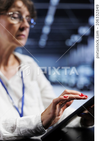 Licensed computer operator using tablet to assess server security vulnerabilities arising due to unsecured network connections. Capable specialist ensuring data center is impenetrable by hacker attack Licensed computer operator using tablet to assess server security vulnerabilities arising due to unsecured network connections. Capable specialist ensuring data center is impenetrable by hacker attack 106332849