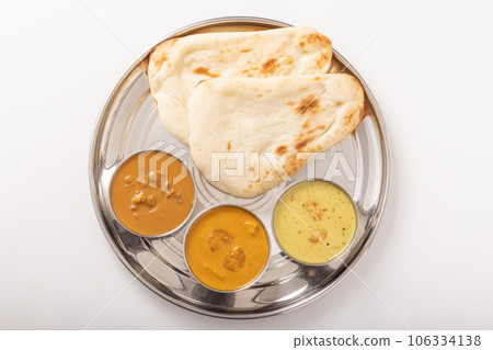 South Indian curry and naan (mutton keema brown masala brown moily) 106334138
