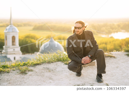 a man stands at the church 106334397