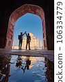 two gay lover standing in front of Taj Mahal indian palace. Islam architecture. 106334779