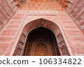 entrance gate of The Taj Mahal is an architectural masterpiece and one of the most iconic landmarks in the world. 106334822