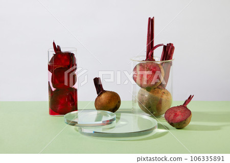 Some glassware containing beetroot slices with juice are displayed with transparent podiums. Laboratory concept with Beetroot (Beta vulgaris) extract. Product promotion Some glassware containing beetroot slices with juice are displayed with transparent podiums. Laboratory concept with Beetroot (Beta vulgaris) extract. Product promotion 106335891