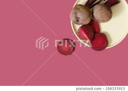 Top view of a pastel dish containing fresh beetroot. Copy space. Beetroot (Beta vulgaris) contains nutrients that may improve athletic performance Top view of a pastel dish containing fresh beetroot. Copy space. Beetroot (Beta vulgaris) contains nutrients that may improve athletic performance 106335913