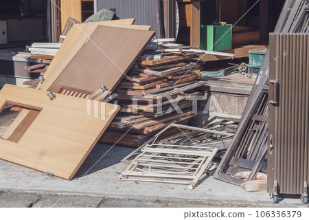 Building materials and scrap metal waste removed during house demolition work Building materials and scrap metal waste removed during house demolition work 106336379