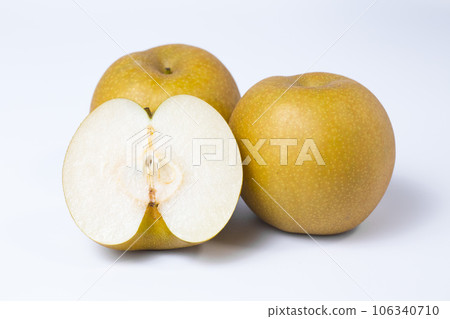 Photograph of a pear cut into pieces on a white background Red pear Shinkansen Photograph of a pear cut into pieces on a white background Red pear Shinkansen 106340710