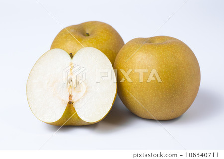 Photograph of a pear cut into pieces on a white background Red pear Shinkansen Photograph of a pear cut into pieces on a white background Red pear Shinkansen 106340711