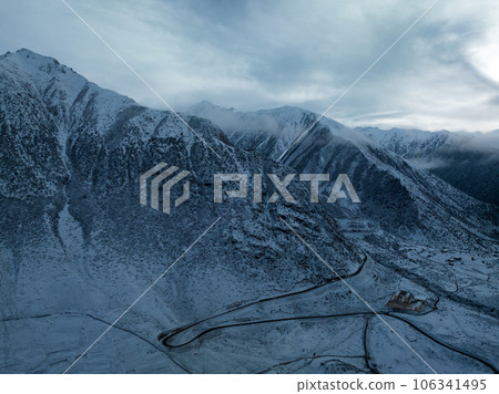 Beautiful snowy forest and village landscape in high altitude mountains tibet, China Beautiful snowy forest and village landscape in high altitude mountains tibet, China 106341495