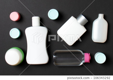 Group of plastic bodycare bottle Flat lay composition with cosmetic products on colored background empty space for you design. Set of White Cosmetic containers, top view with copy space Group of plastic bodycare bottle Flat lay composition with cosmetic products on colored background empty space for you design. Set of White Cosmetic containers, top view with copy space 106343292