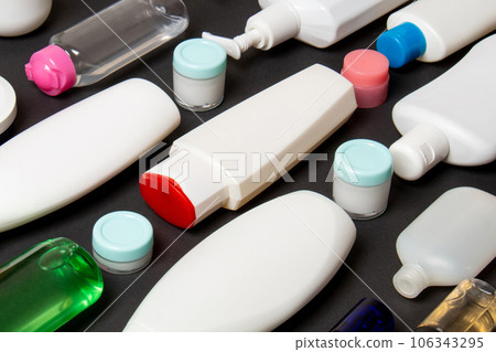 Group of plastic bodycare bottle Flat lay composition with cosmetic products on colored background empty space for you design. Set of White Cosmetic containers, top view with copy space Group of plastic bodycare bottle Flat lay composition with cosmetic products on colored background empty space for you design. Set of White Cosmetic containers, top view with copy space 106343295