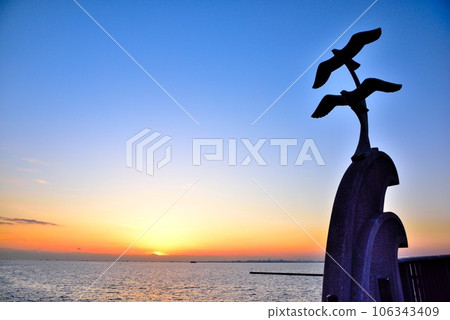 Chiba City: A vivid sunset and the silhouette of the Mihama Ohashi Bridge Chiba City: A vivid sunset and the silhouette of the Mihama Ohashi Bridge 106343409
