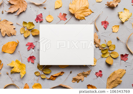 Autumn composition with paper blank and dried leaves on table. Flat lay, top view, copy space Autumn composition with paper blank and dried leaves on table. Flat lay, top view, copy space 106343769