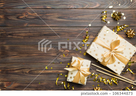 Holiday background with colorful balloon, gift and confetti. Flat lay style. Birthday or party greeting card with copy space 106344873