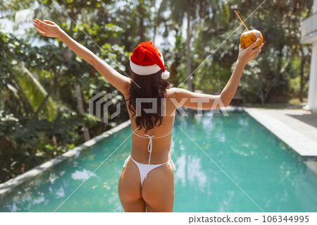 Xmas and New Year Bikini Beach Woman Celebration in Tropical Country Xmas and New Year Bikini Beach Woman Celebration in Tropical Country 106344995