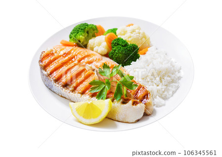 plate of grilled salmon steak, rice and vegetables on white background plate of grilled salmon steak, rice and vegetables on white background 106345561