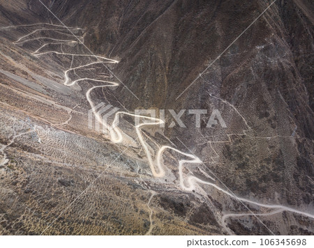 Aerial view car road trip on high altitude mountain trail, China 106345698