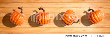 Autumn orange pumpkins overhead view 106346060