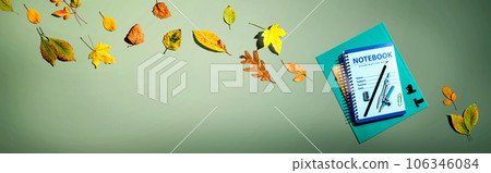 Notebooks with school supplies and autumn leaves 106346084