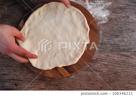 Dought for italian pizza preparation, copy text Dought for italian pizza preparation, copy text 106346211