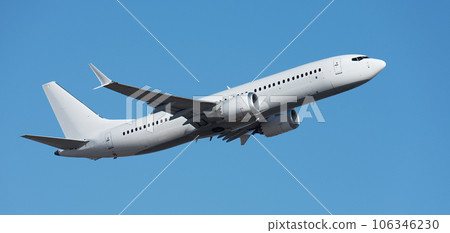 Airplane take off on the blue sky, Aircraft flying on sky background. White passenger jet plane in the blue sky. Low angle view of Airplane flying under blue sky 106346230
