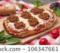 italian pizza bolognese on a wooden board 106347661