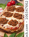 italian pizza bolognese on a wooden board 106347662