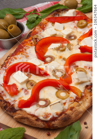 italian pizza with bell pepper, cheese and olives 106347664