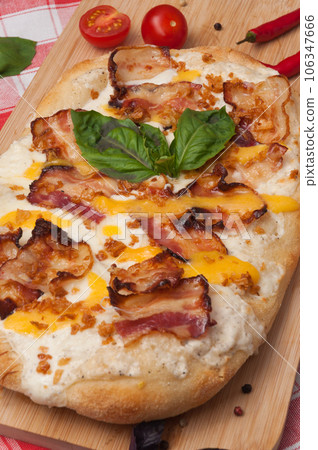 italian pizza with bacon, mozzarella and cheese sauce italian pizza with bacon, mozzarella and cheese sauce 106347666