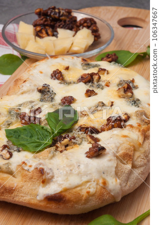 italian pizza 4 cheeses with caramelized walnuts italian pizza 4 cheeses with caramelized walnuts 106347667