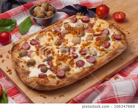 italian pizza with sausages, mushrooms and mozzarella italian pizza with sausages, mushrooms and mozzarella 106347669