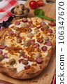 italian pizza with sausages, mushrooms and mozzarella 106347670