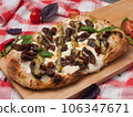 italian pizza with beef, mozzarella and pesto 106347671